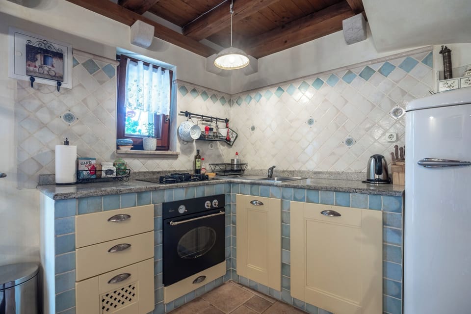 Villa | Private kitchen | Fridge, microwave, oven, stovetop