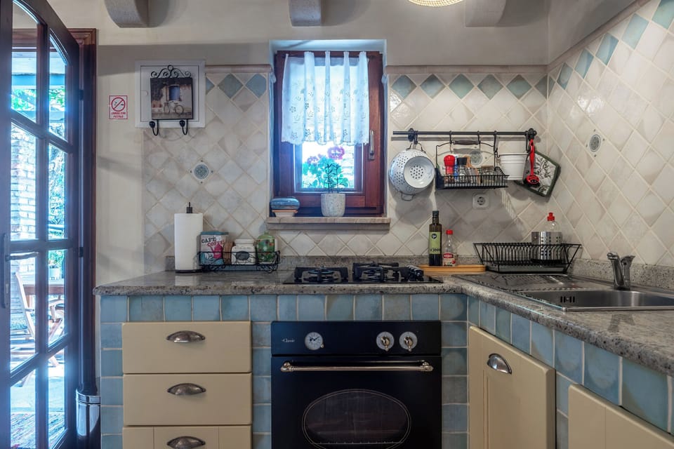 Villa | Private kitchen | Fridge, microwave, oven, stovetop