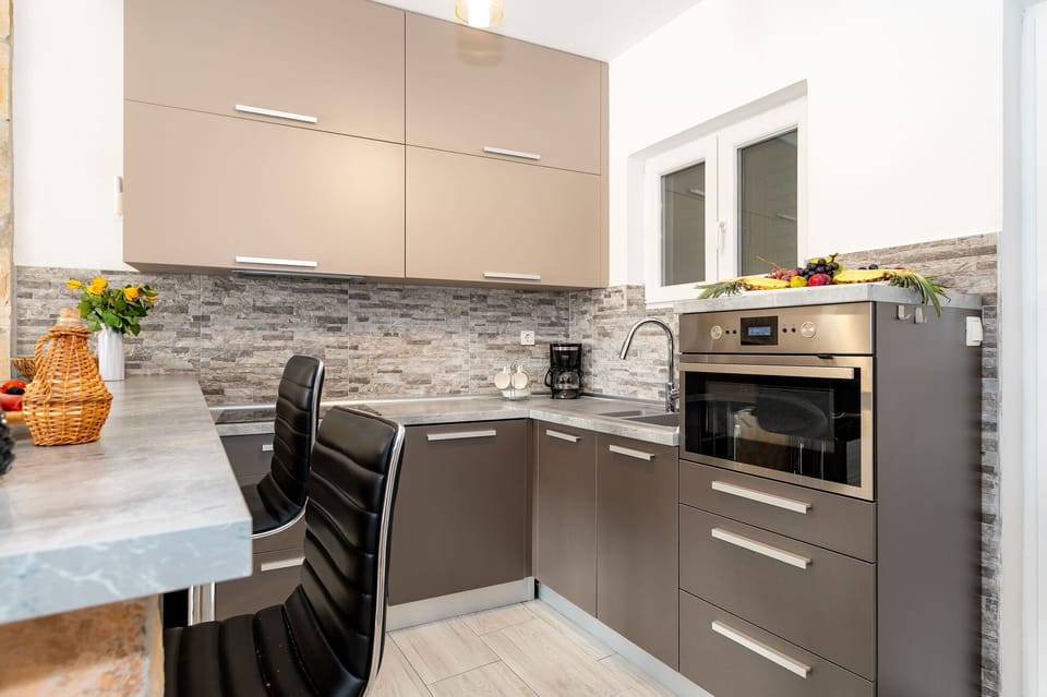 Villa | Private kitchen | Fridge, microwave, oven, stovetop