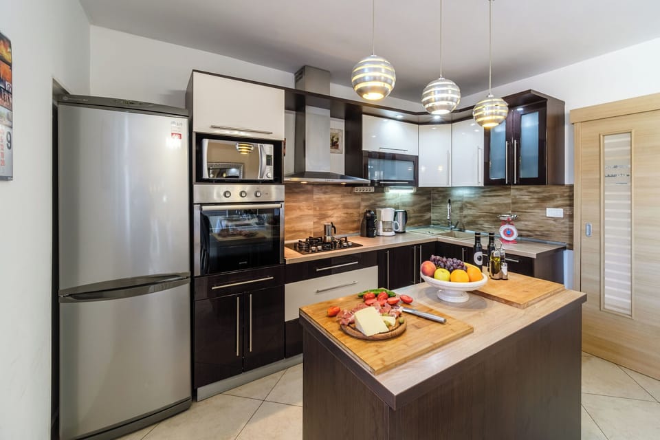 Villa | Private kitchen | Fridge, microwave, oven, stovetop