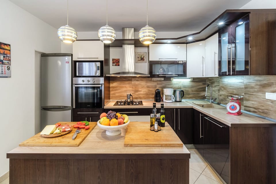 Villa | Private kitchen | Fridge, microwave, oven, stovetop