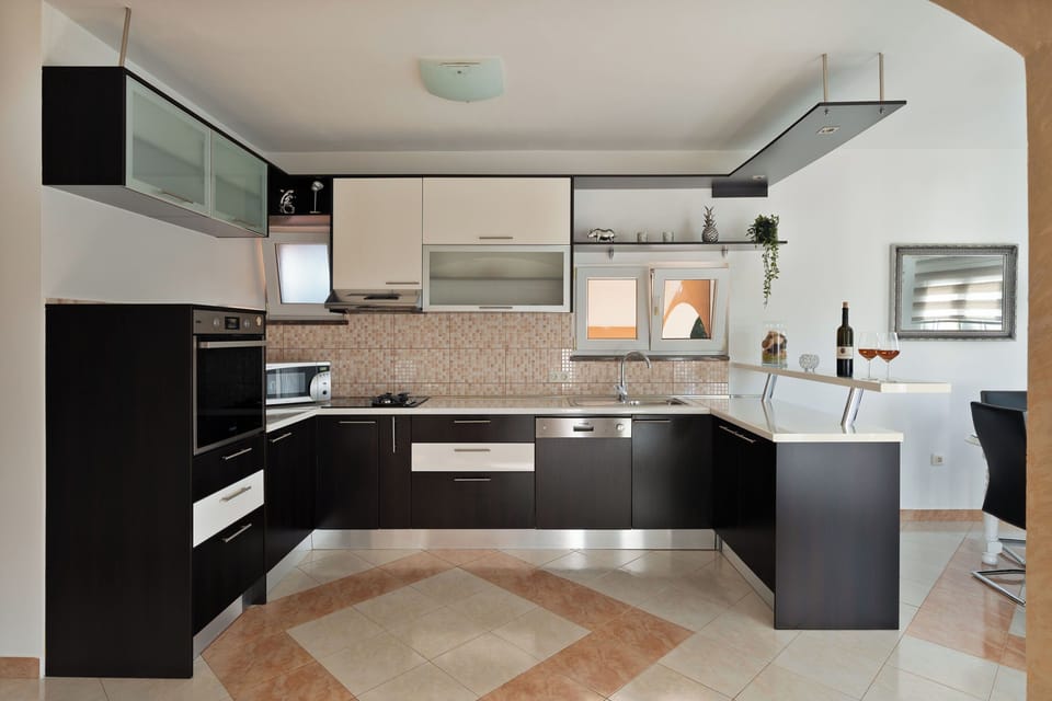 Villa | Private kitchen | Fridge, microwave, oven, stovetop