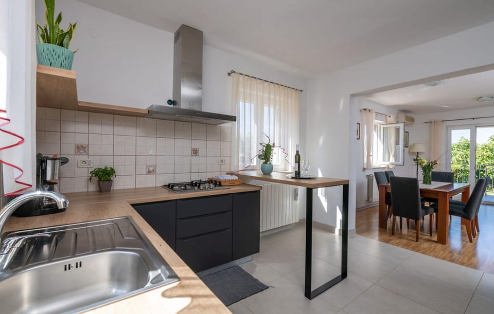 Villa | Private kitchen | Fridge, microwave, oven, stovetop