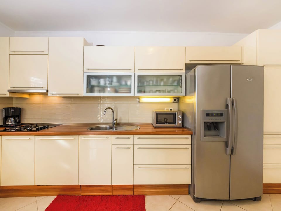 Villa | Private kitchen | Fridge, microwave, oven, stovetop