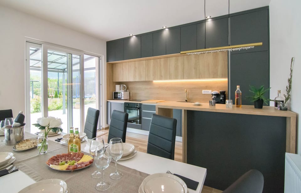 Villa | Private kitchen | Fridge, microwave, oven, stovetop