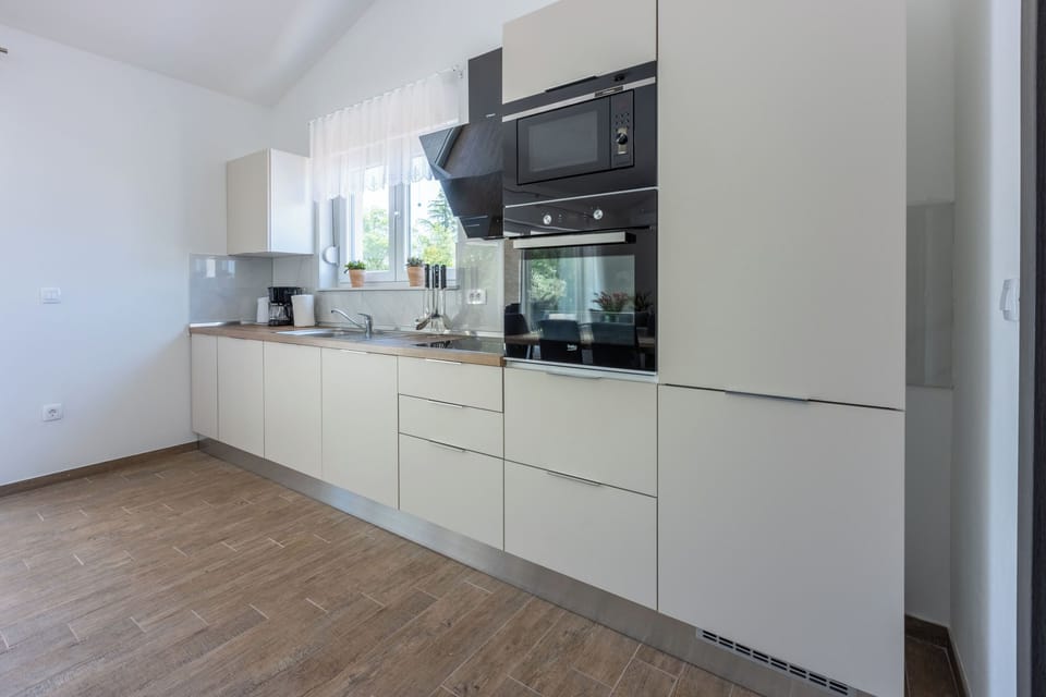 Villa | Private kitchen | Fridge, microwave, oven, stovetop