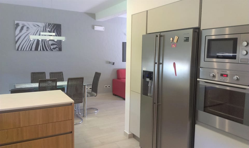 Villa | Private kitchen | Fridge, microwave, oven, stovetop