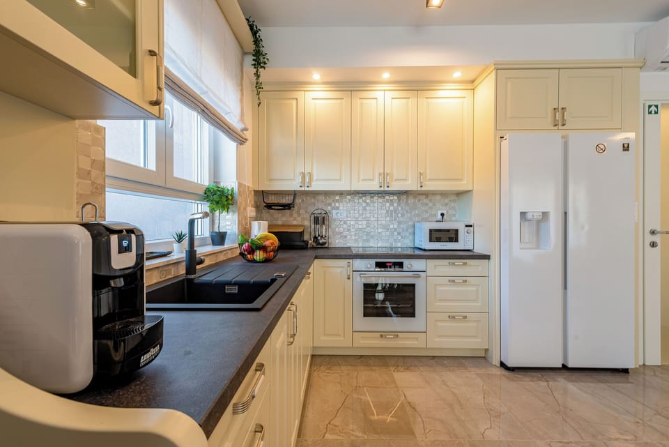 Villa | Private kitchen | Fridge, microwave, oven, stovetop