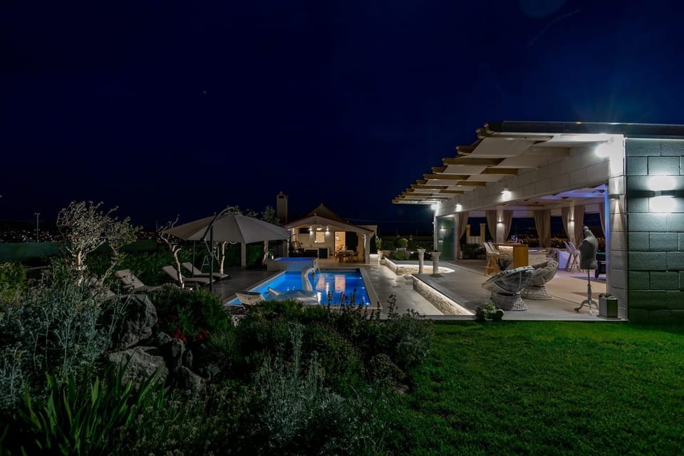 Outdoor pool, a heated pool, pool umbrellas