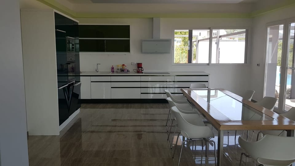 Villa | Private kitchen | Fridge, microwave, oven, stovetop