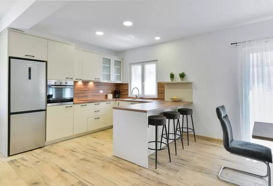 Villa | Private kitchen | Fridge, microwave, oven, stovetop
