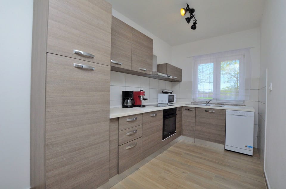 Villa | Private kitchen | Fridge, microwave, oven, stovetop