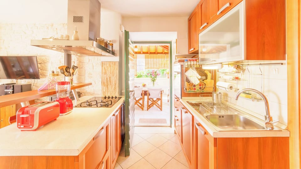 Villa | Private kitchen | Fridge, microwave, oven, stovetop