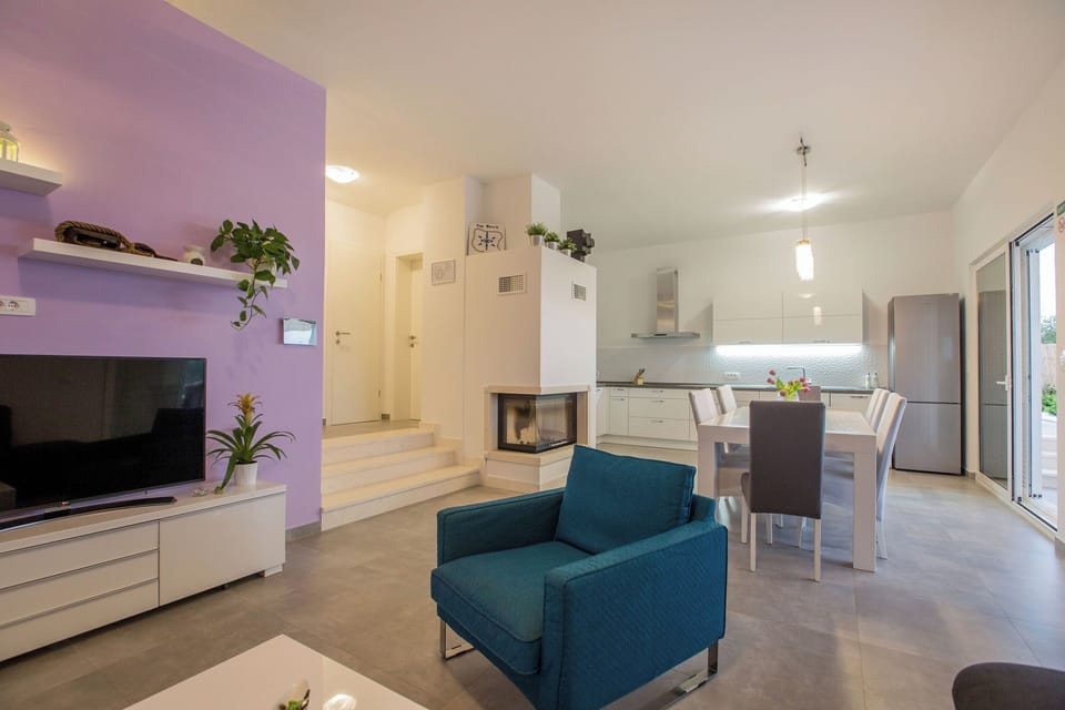 Villa | Living room | Flat-screen TV, fireplace