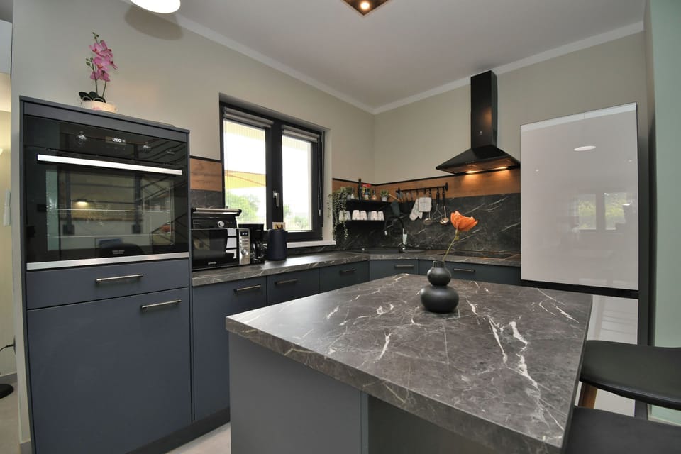 Villa | Private kitchen | Fridge, microwave, oven, stovetop