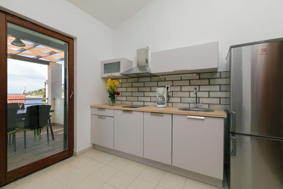 Villa | Private kitchen | Fridge, microwave, oven, stovetop