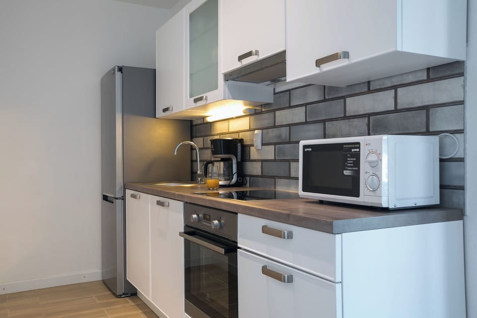 Villa | Private kitchen | Fridge, microwave, oven, stovetop