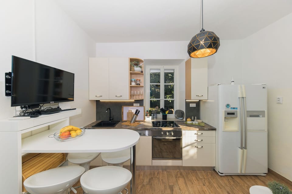 Villa | Private kitchen | Fridge, oven, stovetop, dishwasher