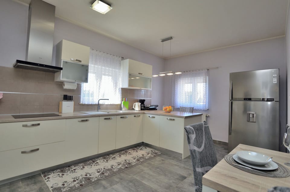 Villa | Private kitchen | Fridge, microwave, oven, stovetop