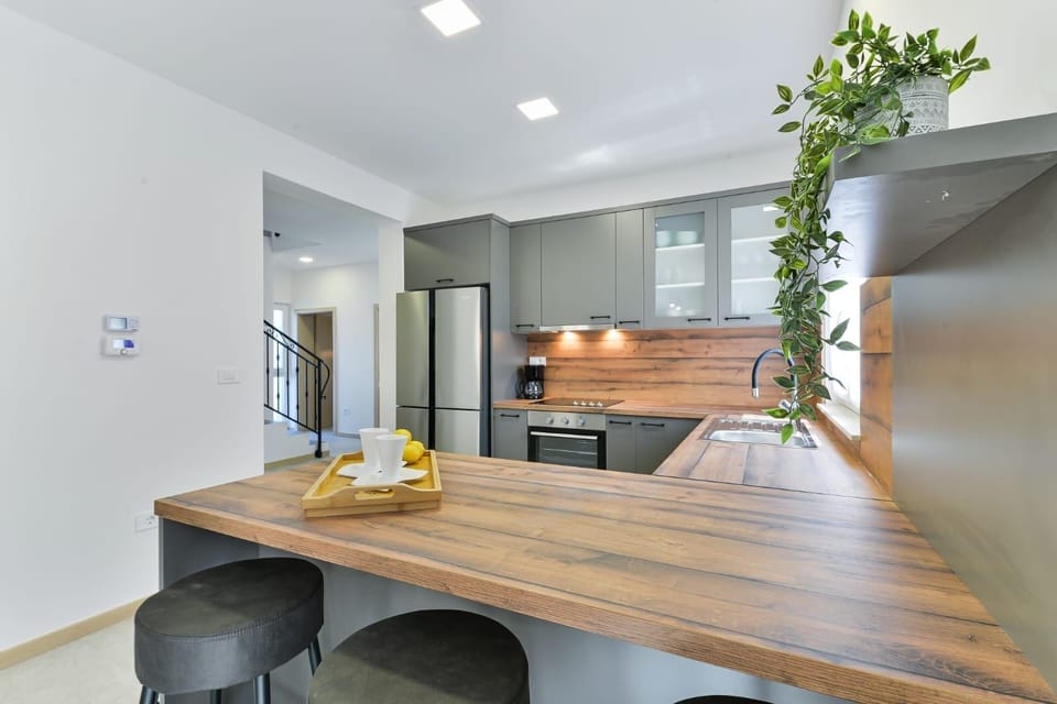 Villa | Private kitchen | Fridge, microwave, oven, stovetop