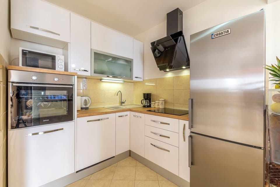 Villa | Private kitchen | Fridge, microwave, oven, stovetop