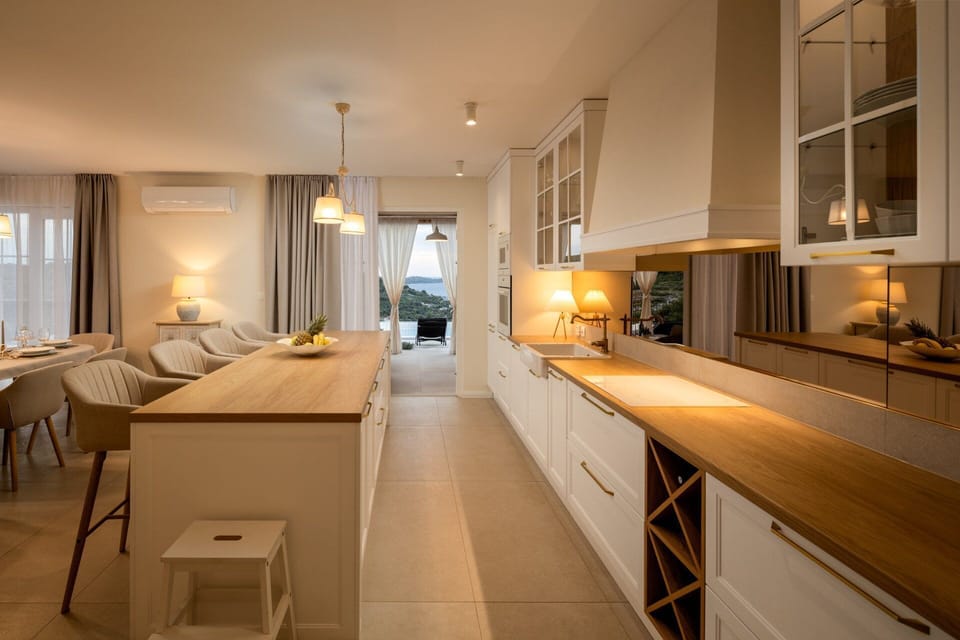 Villa | Private kitchen | Fridge, microwave, oven, stovetop
