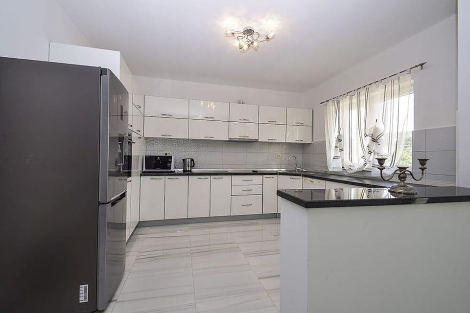 Villa | Private kitchen | Fridge, microwave, oven, stovetop