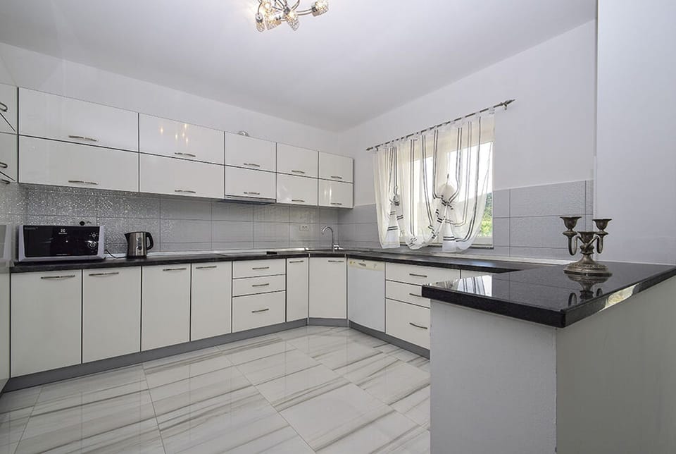 Villa | Private kitchen | Fridge, microwave, oven, stovetop