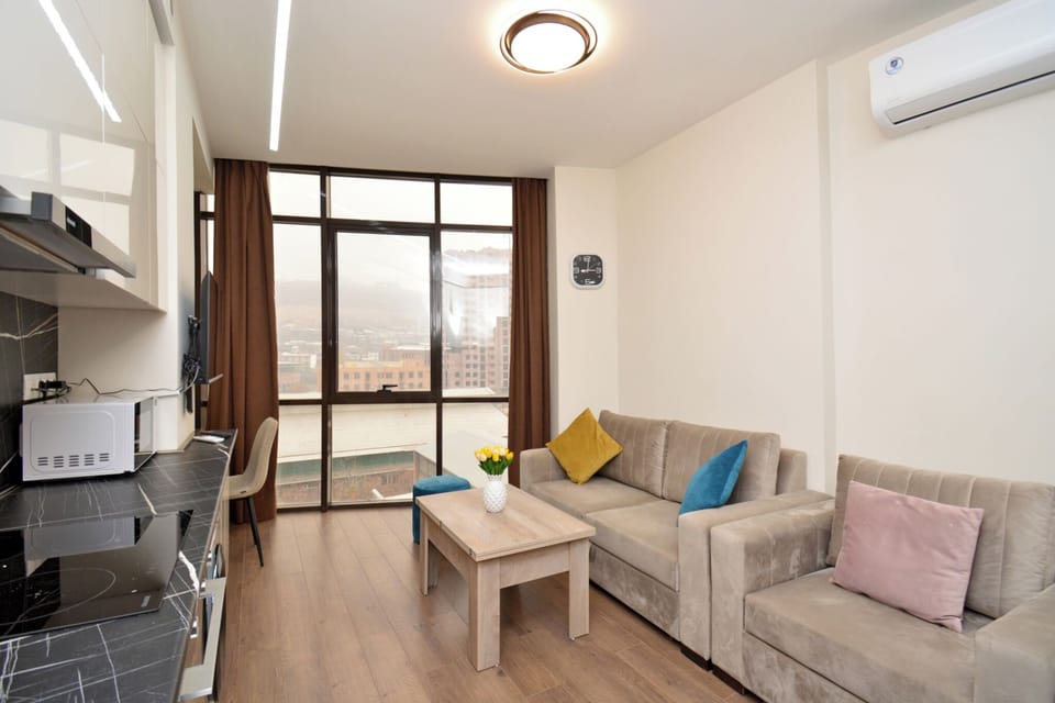 Condo, City View | Living area | 50-inch flat-screen TV with cable channels