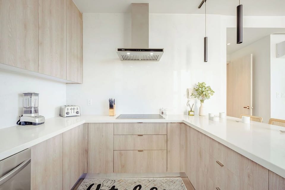 Your fully equipped kitchen features sleek countertops, modern appliances, and plenty of space to prepare meals just the way you like them.