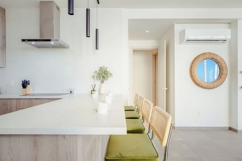 Your bright open kitchen and dining space welcomes you with modern finishes, cozy seating, and climate-controlled comfort perfect for shared meals and relaxed mornings.