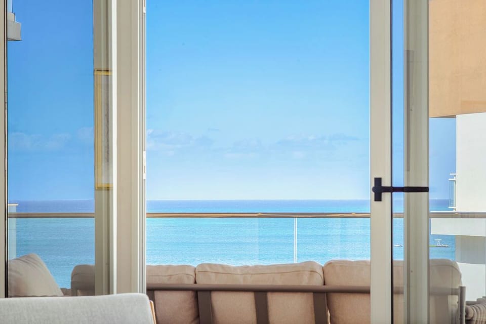 Stunning oceanfront views framed by your private balcony, where endless blue waters meet the horizon. Unwind on your terrace sofa and let the sea breeze refresh your senses.