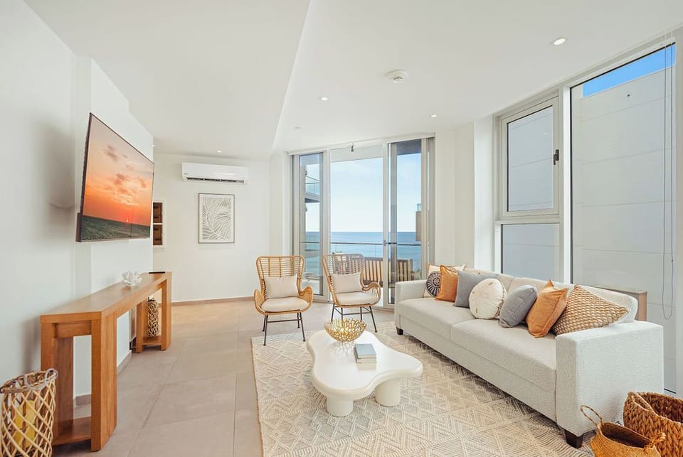 Unwind in your coastal-chic living space, where soft textures meet soothing sea views. Curl up on the plush sofa, feel the ocean breeze, and let the waves become your daily soundtrack.