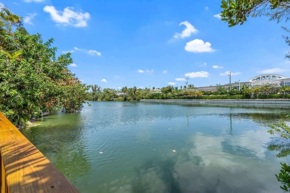 Enjoy peaceful waterfront views in this lush urban escape—where nature meets city charm. Ideal for vacation rental guests who love serene strolls, scenic backdrops, and relaxing moments by the water. Your tranquil getaway is calling!
