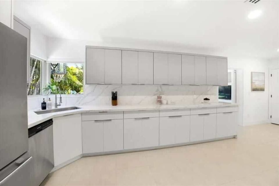 Enjoy this sleek kitchen with modern appliances, minimalist design, and natural light. Perfect for guests who love cooking in style.