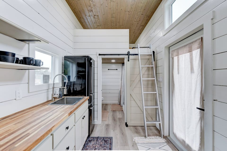 The bathroom and second bedroom are at the right end of the kitchenette