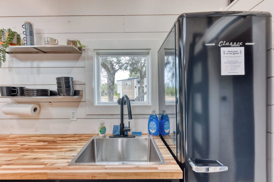 There is a mini fridge in the kitchenette