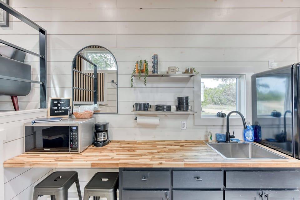 The tiny home features a kitchenette
