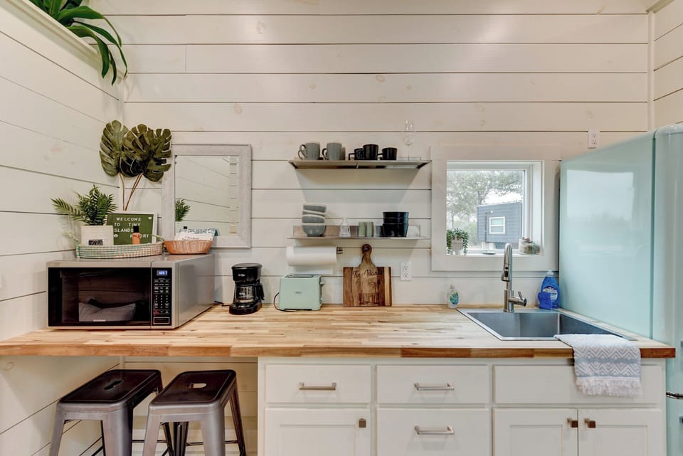 The tiny home features a kitchenette