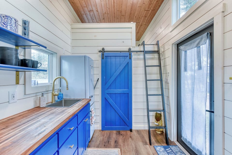 The bathroom and second bedroom are at the right end of the kitchenette