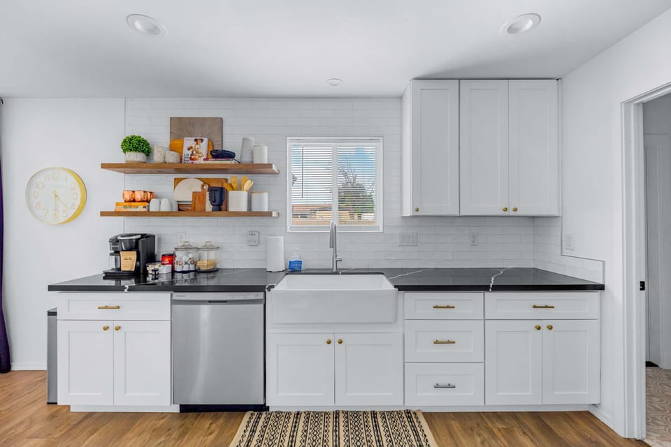 Enjoy the convenience of a fully stocked kitchen with open shelving and coffee station.