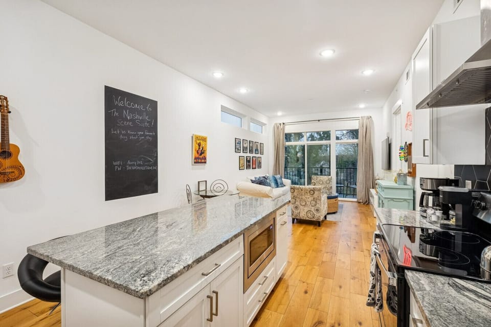 Fully stocked kitchen with stainless steel appliances and all you`d need to make a home cooked meal