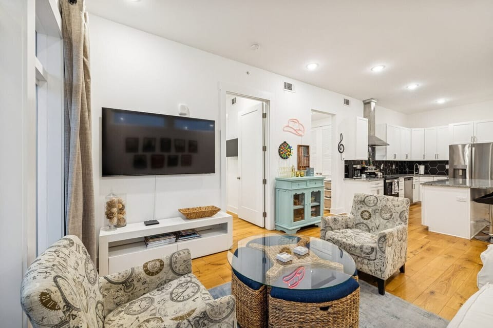 Living room features a pull out sofa, Smart TV, private patio, and more
