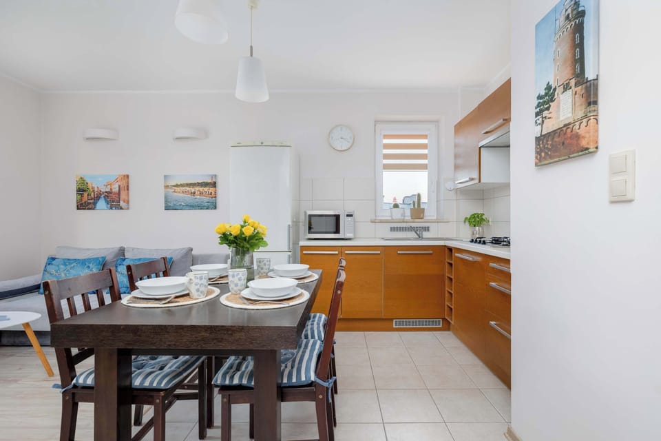 The sleek design of the kitchenette blending seamlessly with the living area.
