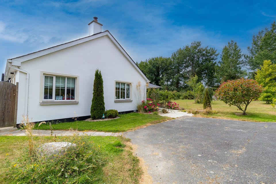 Brittas Bay Holiday Park No. 7. Exterior garden with trees. Private parking area.