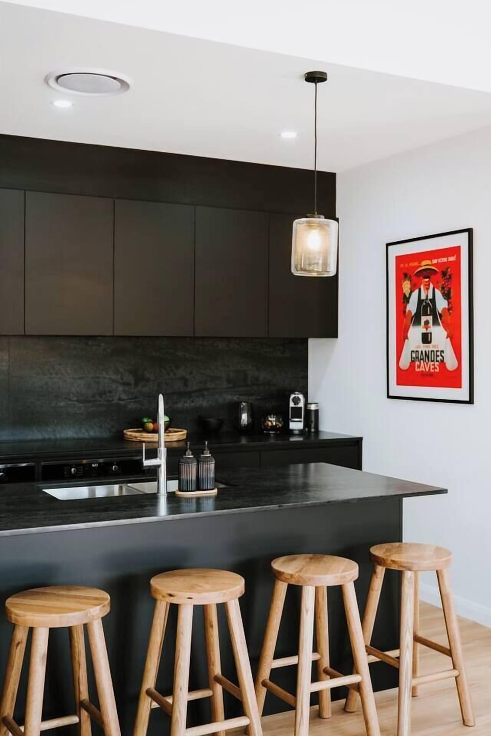 Pull up a stool for casual breakfasts or evening drinks around the island bench, a social hub at the heart of the home.
