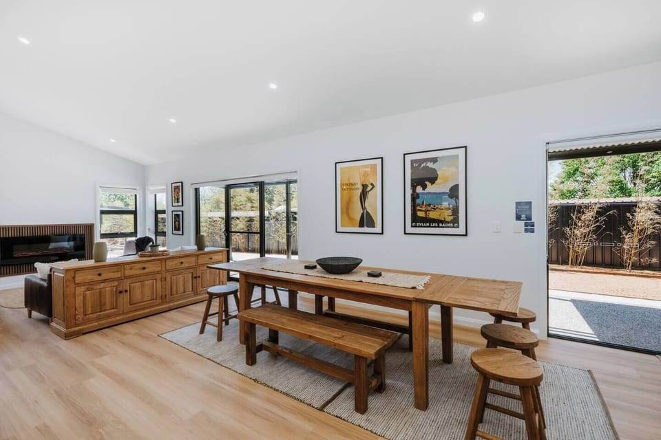 Share long meals and local wine at the inviting timber dining table.