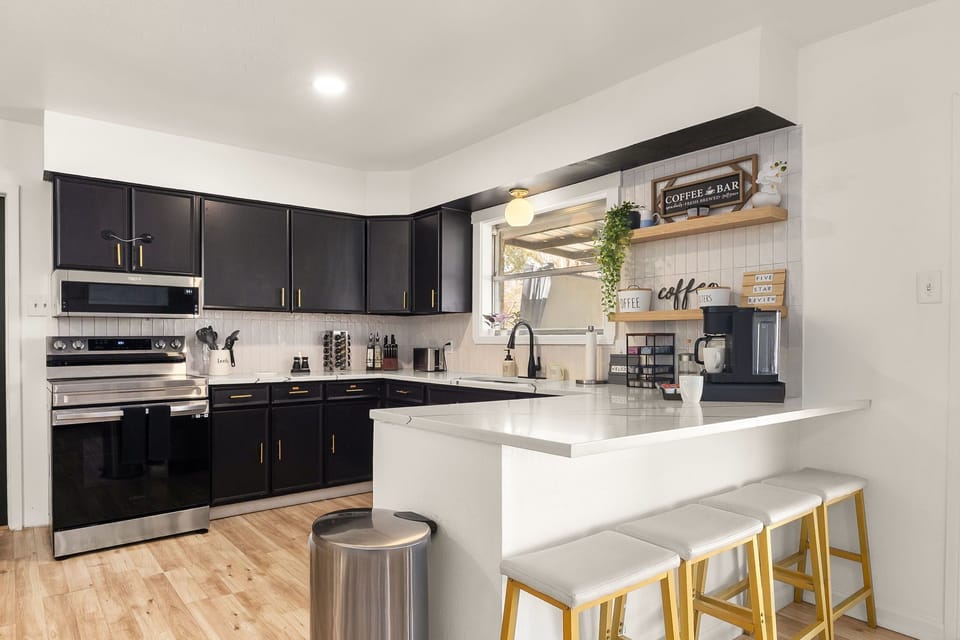 Cook with ease in the fully stocked kitchen featuring stainless steel appliances