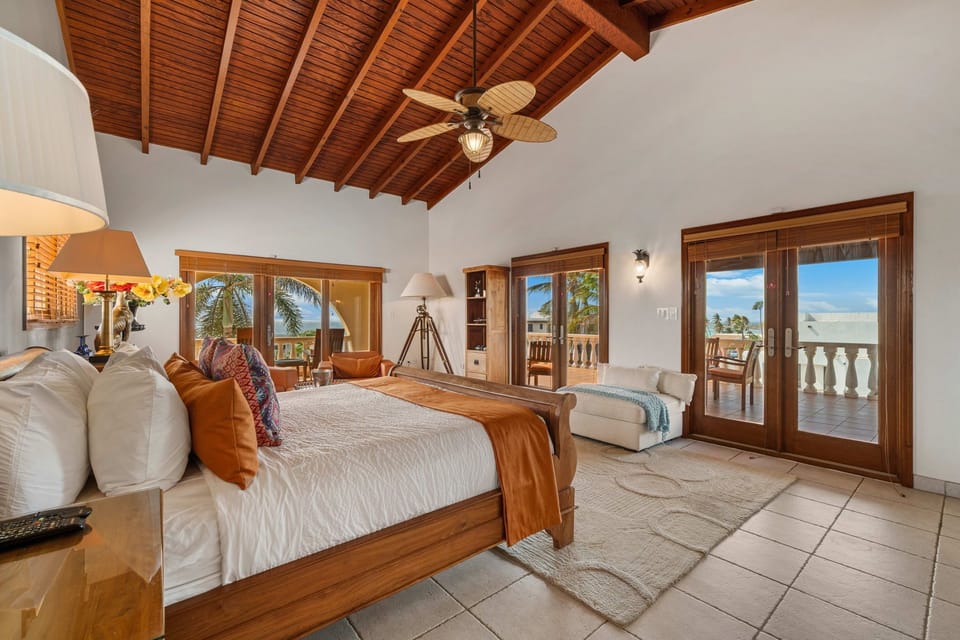 Bedroom 1 features a king size bed and a balcony with an amazing view