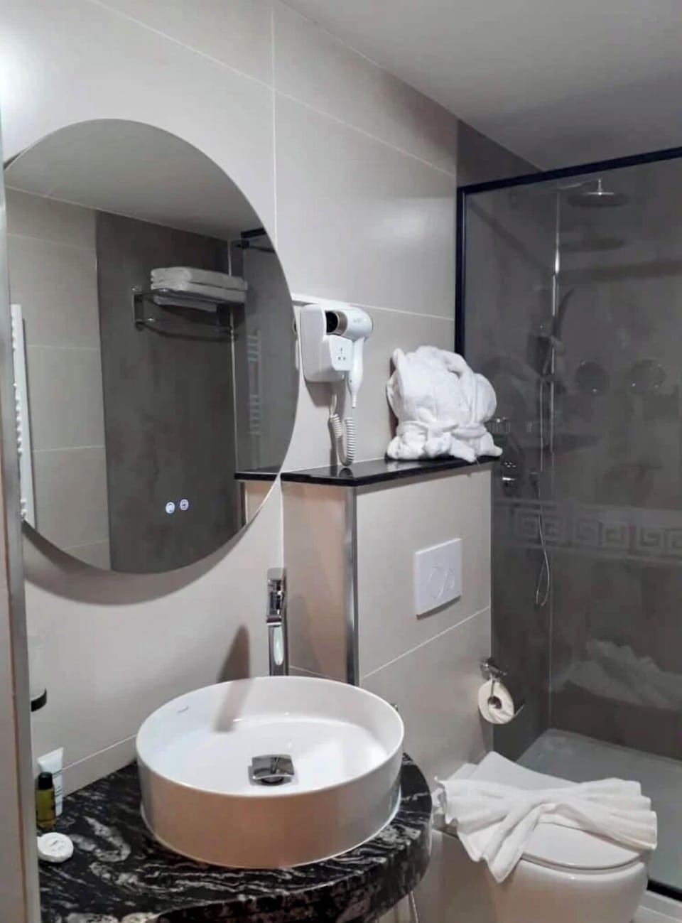 Shower, free toiletries, hair dryer, towels